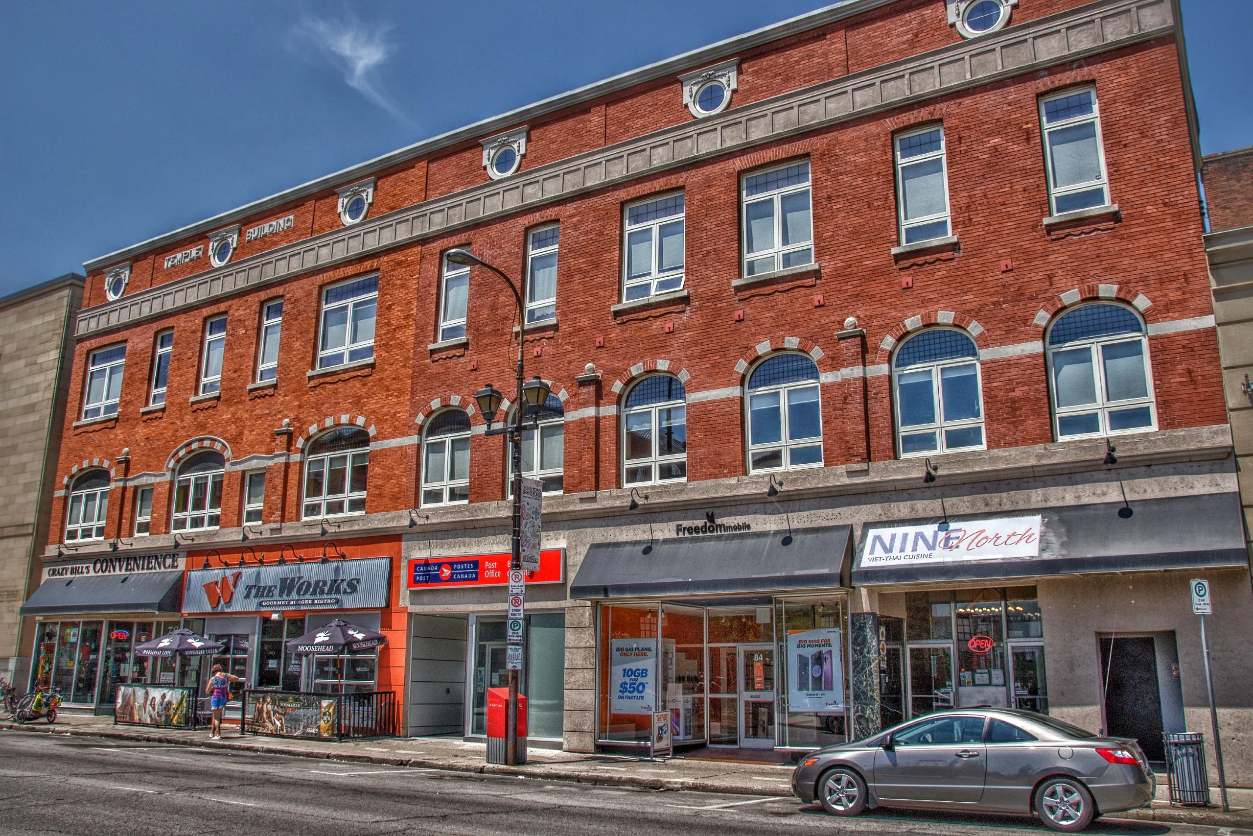Downtown Brantford storefronts A row of brick heritage buildings with shopfronts on a street in downtown Brantford