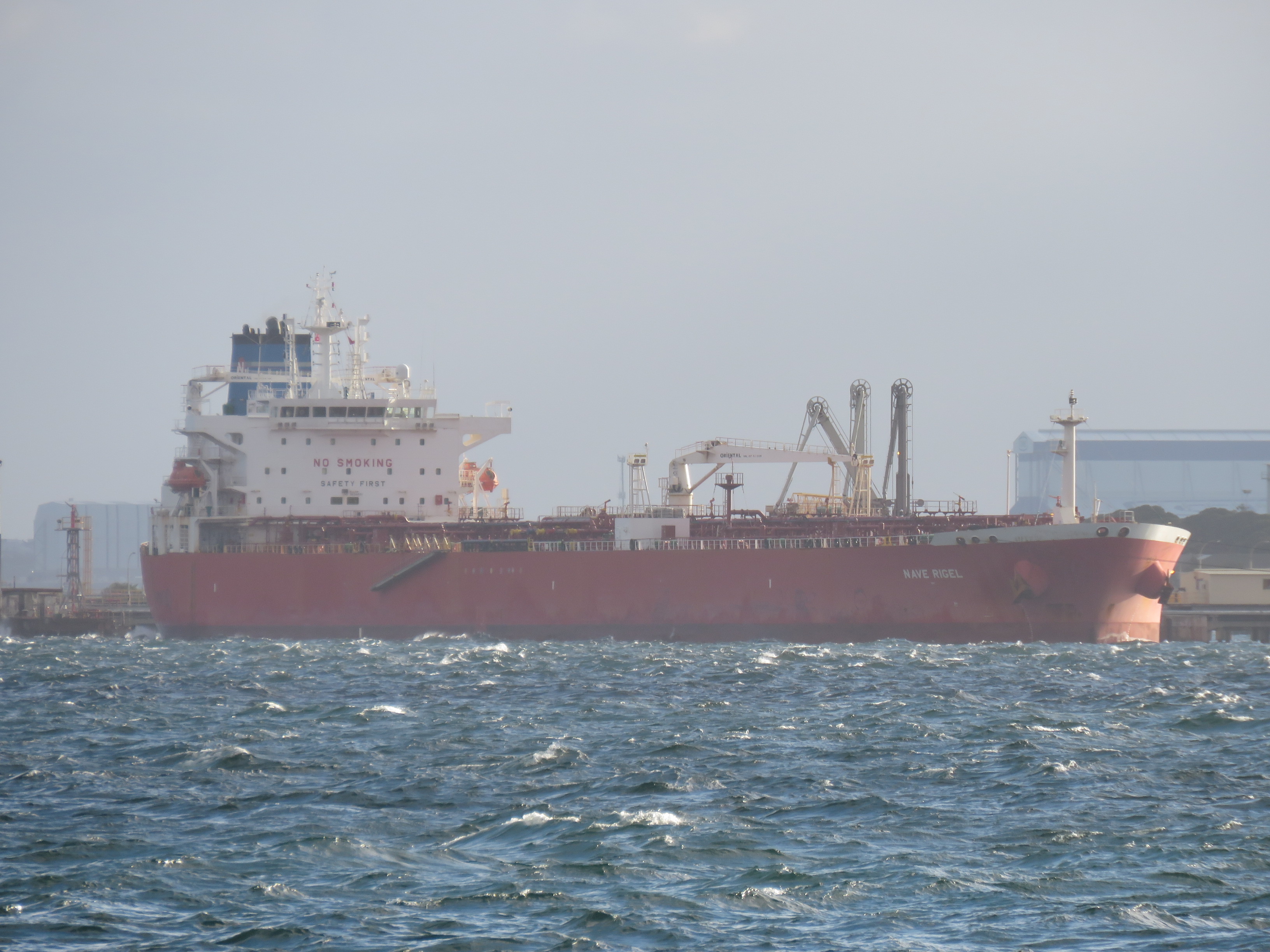 A crude oil tanker at a refinery jetty