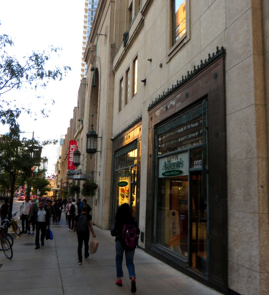 Storefronts and pedestrians on Yonge Street in downtown Toronto