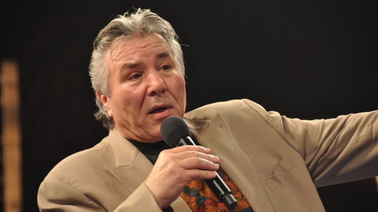 George Chuvalo speaking into a microphone