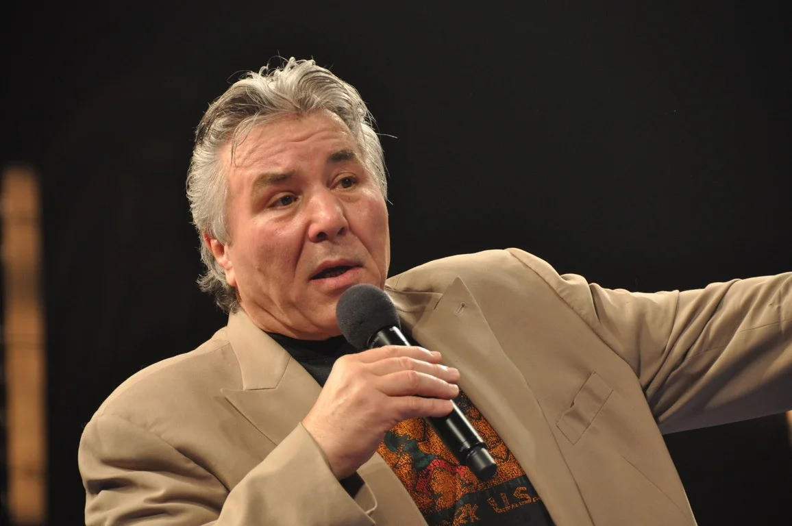George Chuvalo speaking into a microphone