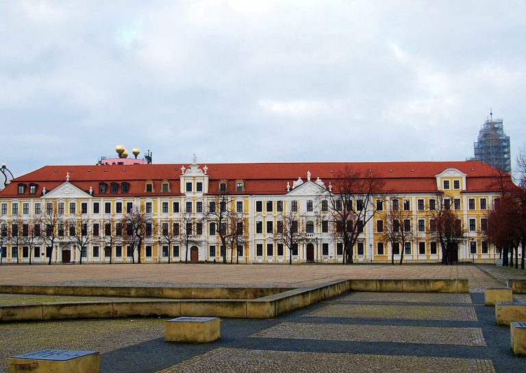 The Landtag of Saxony-Anhalt, the yellow state parliament building on Domplatz in Magdeburg, seen across the empty square