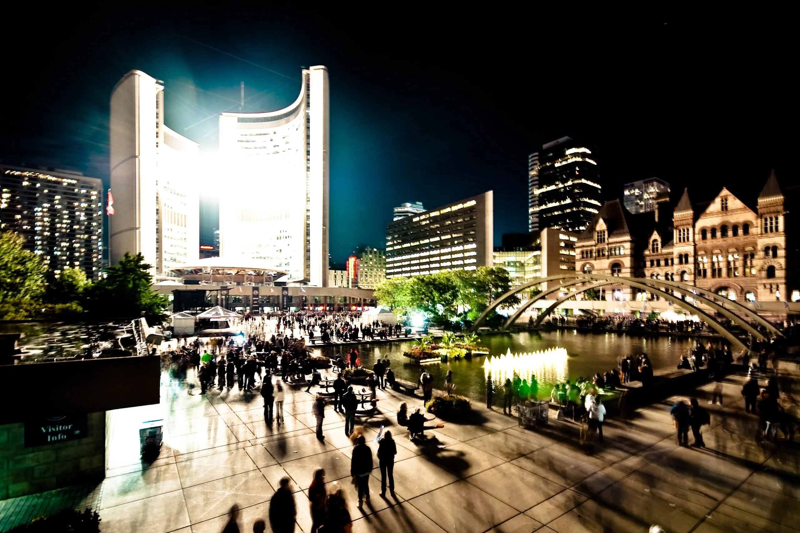 Nuit Blanche at Nathan Phillips Square Crowds filling Nathan Phillips Square at night with Toronto City Hall lit behind them during Nuit Blanche