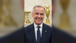 Prime Minister Mark Carney standing in the White House, May 2025