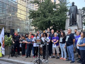 Toronto and York Region Labour Council president Andria Babbington speaking to union members and media in front of the Sir Adam Beck statue at Queen Street and University Avenue on Labour Day morning.